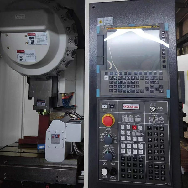 cnc-tapping-center-machining-area-control-system CNC tapping center machining area and control system showing spindle workspace and operation interface