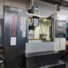 heavy-duty-cnc-machining-center-side-view Side view of heavy duty CNC machining center showing rigid frame and large machine structure
