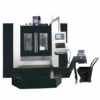 heavy-duty-vertical-machining-center-front-view Heavy duty vertical machining center front view with full enclosure for industrial metal machining