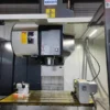 heavy-duty-vertical-machining-center-machining-area Large machining area inside heavy duty vertical machining center with spindle and worktable