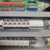 high-speed-machining-center-electrical-cabinet Electrical cabinet interior of high-speed machining center with CNC control components and wiring system