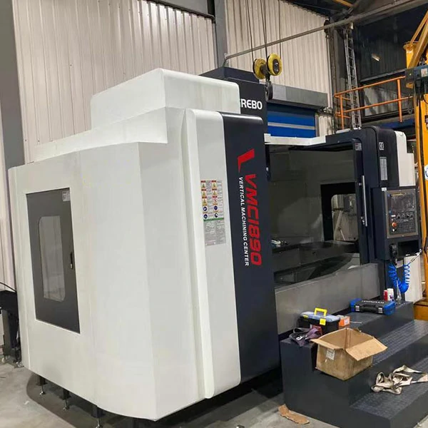 large-cnc-machining-center-installed-workshop-left-view Large CNC machining center installed in workshop showing machine size and industrial installation environment